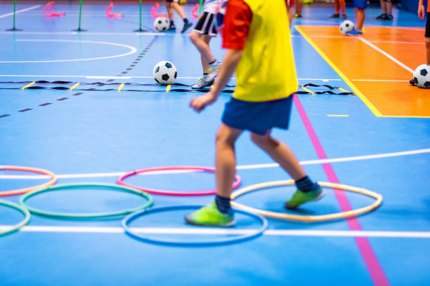 indoor soccer class for kids at school sports hall children